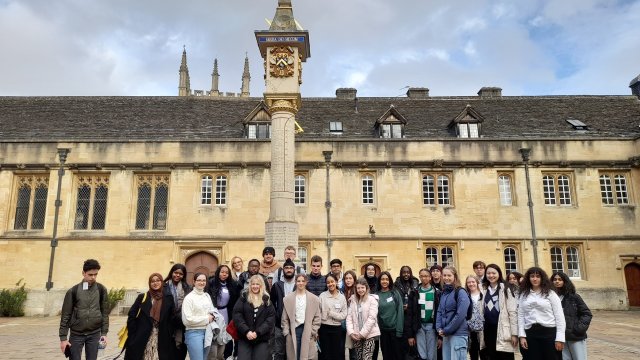 Law Residential attendees stand in front of the Sundial in Corpus Christi's Main Quad